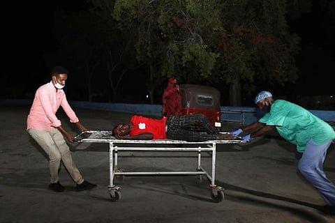 At least 20 killed by suicide car bomb near restaurant in Somalia capital