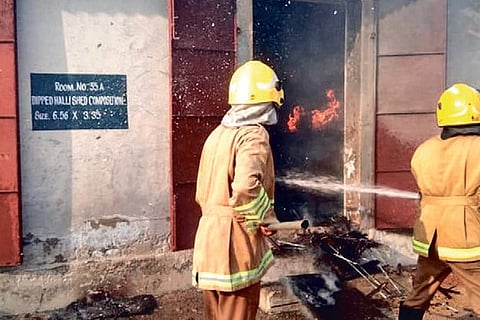 Fire fighters in action at GN Patti on Saturday.