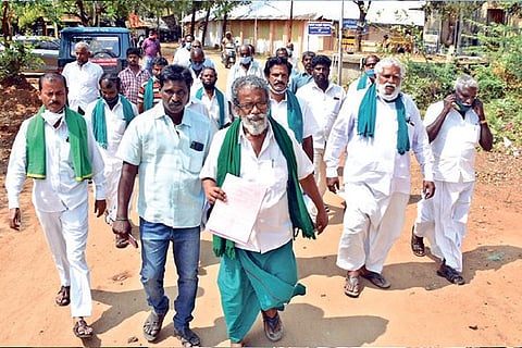 Farmers after collecting application forms to file nominations in Tiruchy