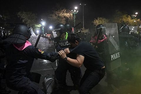Thai police clash with protesters near king's palace