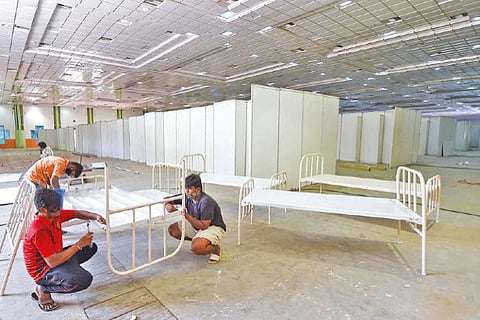 Workers convert Chennai Trade Centre into an isolation ward for COVID patients