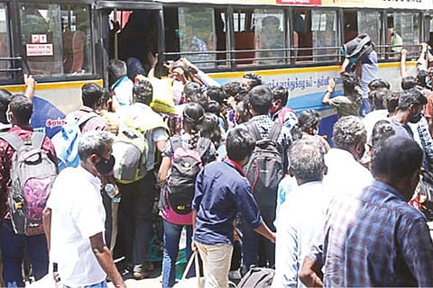 People seen rushing into a bus to get back home in Coimbatore on Sunday