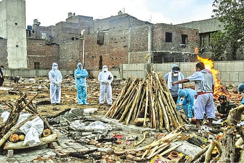 An Indian Malady: At funeral pyres, COVID affects rites of grief