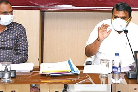 Transport Minister RS Raja Kannappan (r) during a meeting with the officials of the State Transport.
