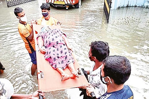 Naval officers rescue an old woman in Ernakulam district