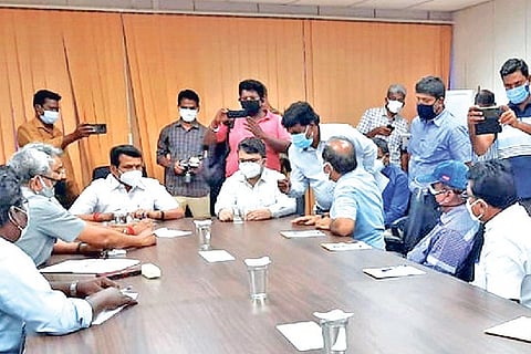 Minister V Senthil Balaji conducting a review meeting in Karur on Monday