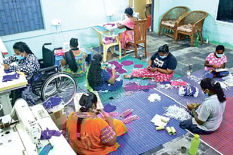 Differently-abled women engaged in mask making