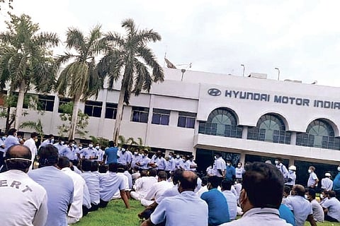 A sit in protest by HMIL workers on Monday