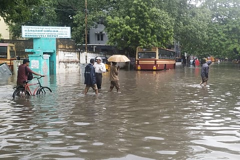 People wading through a flooded road near Mandeveli depot (Image source: Twitter)