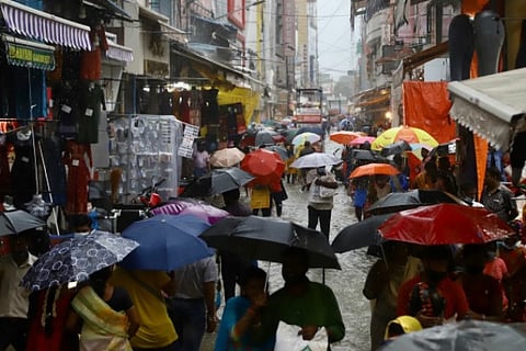 People walking through Ranganathan Street, T Nagar despite heavy downpour (Photo: Manivasagan)