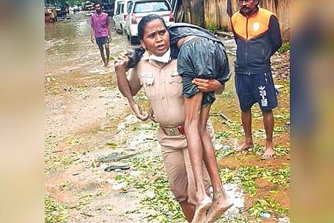 Inspector Rajeswari with the worker on her shoulder