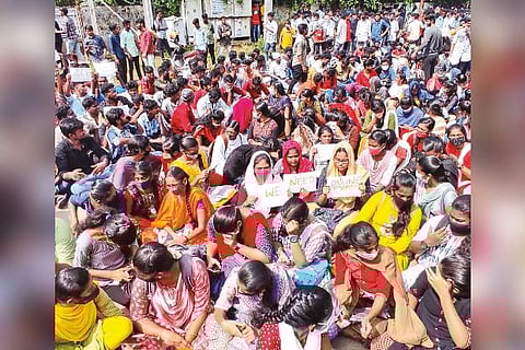 Students squatting in front of Madurai Collectorate as part of their protest on Monday
