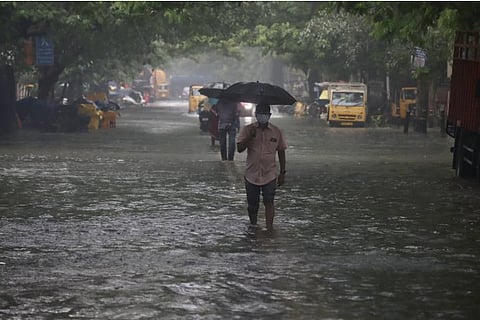 A man wades through a flooded road in Chennai (File Photo)