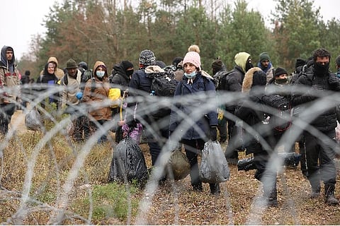 Hundreds of Migrants gather at Belarus-Poland border  (Image Source: Reuters)
