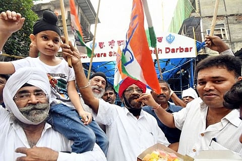 Congress supporters distribute sweets and celebrate the farm laws repeal (Source: ANI)