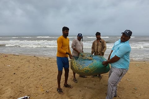 Fishermen bringing their catch to the shore. Photo: Justin