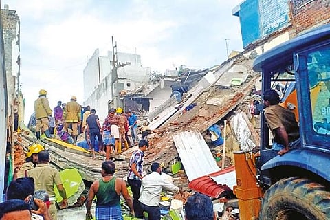 Rescue operations under way in the collapsed house after a cylinder explosion in Salem on Tuesday.