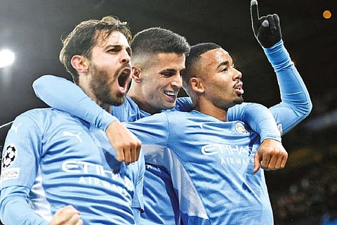 Manchester City players celebrate the winning goal against Paris St Germain
