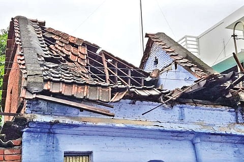 A tiled house damaged in rains at Pettai in Tirunelveli