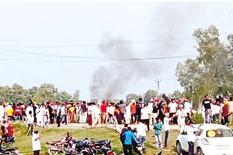 A vehicle set ablaze after violence broke out.