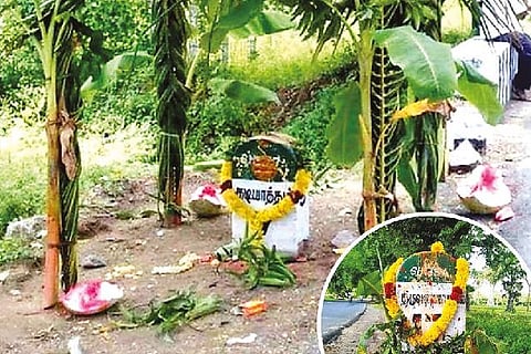 The milestones adorned with festoons and pooja items.