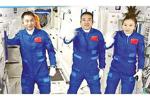 (From left) Astronauts Ye Guangfu, Zhai Zhigang and Wang Yaping