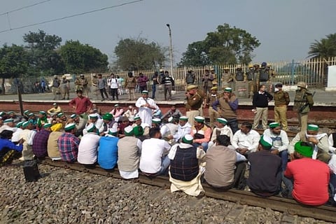 Farm Law protestors sit on railway tracks in Uttar Pradesh