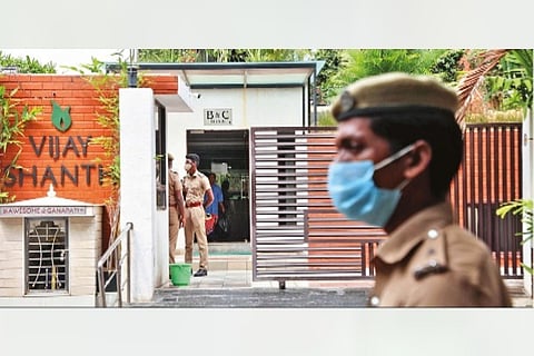 Security personnel stand guard at Former TN Health Minister C Vijaya Baskar's residence at Kilpauk