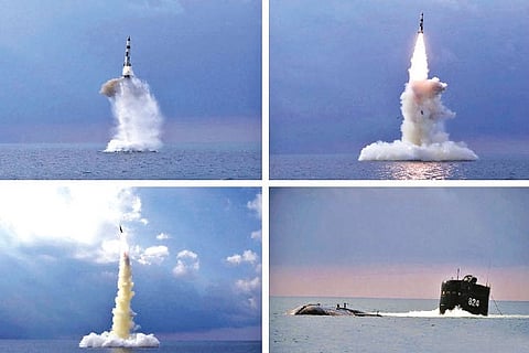 Photos provided by North Korean govt shows a ballistic missile launched from a submarine