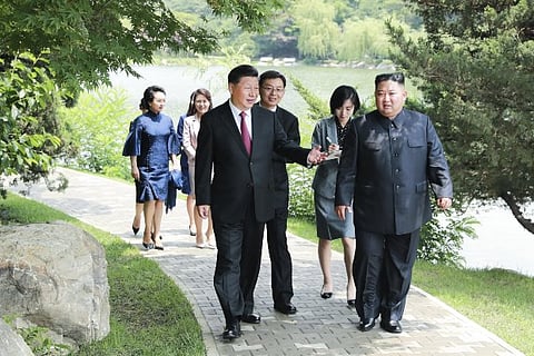 Chinese Premier Xi Jinping and North Korean Leader Kim Jong-un