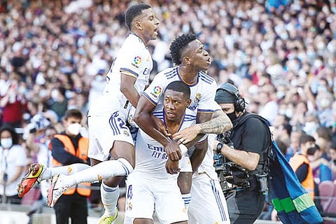 Real Madrid players celebrate after scoring the opening goal