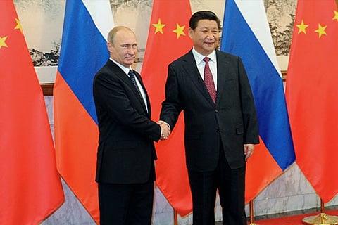 (Left) Putin with Xi Jingping. File photo