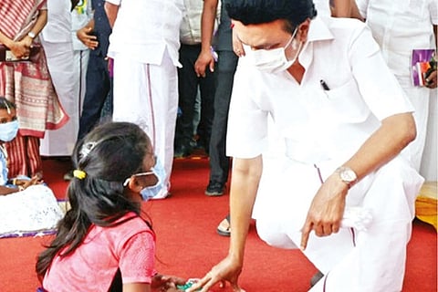 Chief Minister MK Stalin interacting with a student covered under Illam Thedi Kalvi scheme