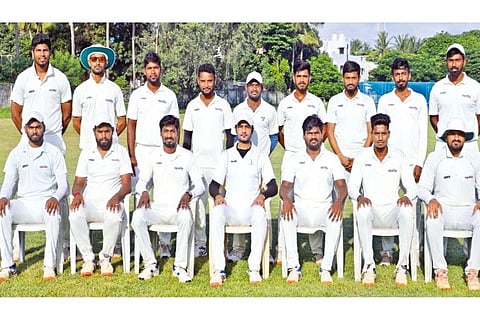 Apollo Tyres squad members pose for the winner?s photograph. The team won the final by 3 runs
