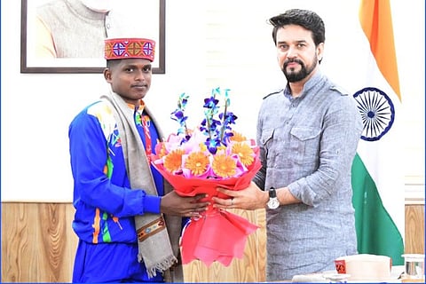 Tokyo Paralympics silver medalist Thangavelu Mariyappan with Union Sports Minister Anurag Thakur