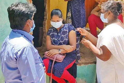 Corporation officials overseeing the door-to-door vaccination