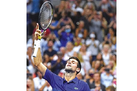 File Photo : World number one Novak Djokovic celebrates after entering the quarter-finals of the US