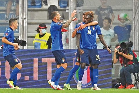 Moise Kean (right) celebrates after scoring his first goal against Lithuania