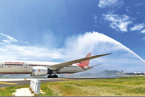 An Air India flight being accorded a water cannon salute at the new taxiway