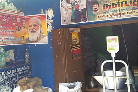 The posters of BJP and DMK on the wall of a PDS shop