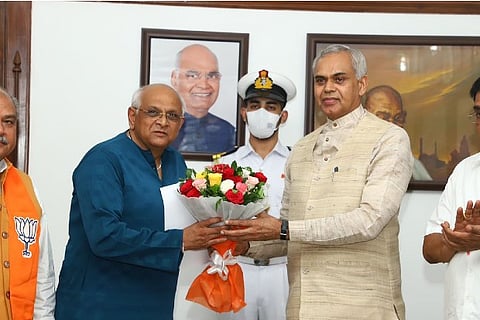 Bhupendra Patel (right) and Governor Acharya Devvrat (left)