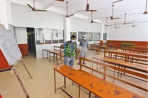 A Corporation worker disinfecting the Grove School in Alwarpet