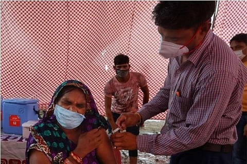 A woman receives COVAXIN (Credit: Reuters)