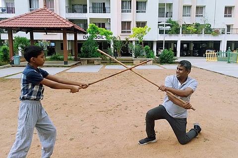 A boy practising martial art Silambam with his Coach (File Photo)