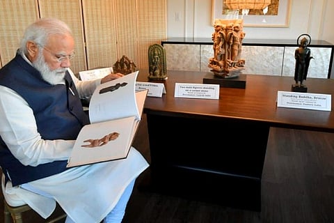 PM Modi looks on at artefacts handed over to India by US which include cultural antiquities.