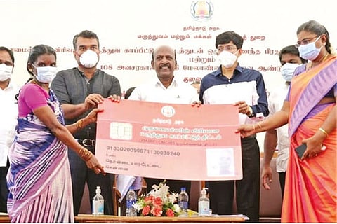 Health Minister Ma Subramanian and officials with a replica of the new CMCHIS ID card in Chennai