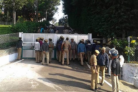 Police outside the Kodanad estate.