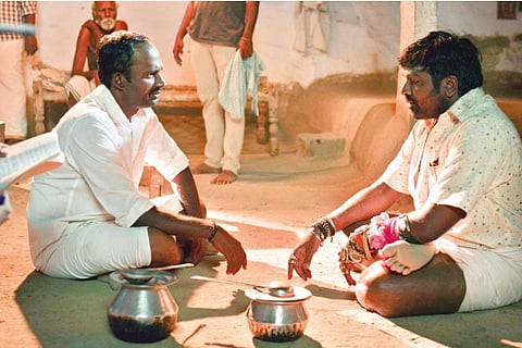Manikandan and Vijay Sethupathi discuss a scene
