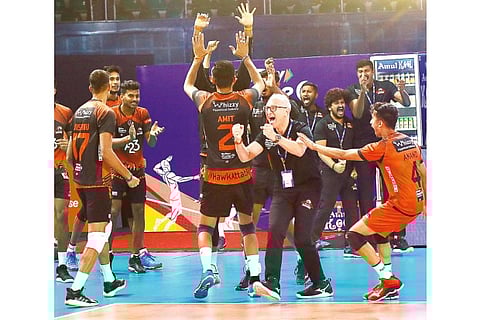 The Hyderabad Black Hawks players and staff celebrate after clinching a set against Chennai Blitz