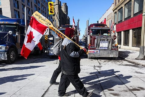 Protestors with the Canadian flag.